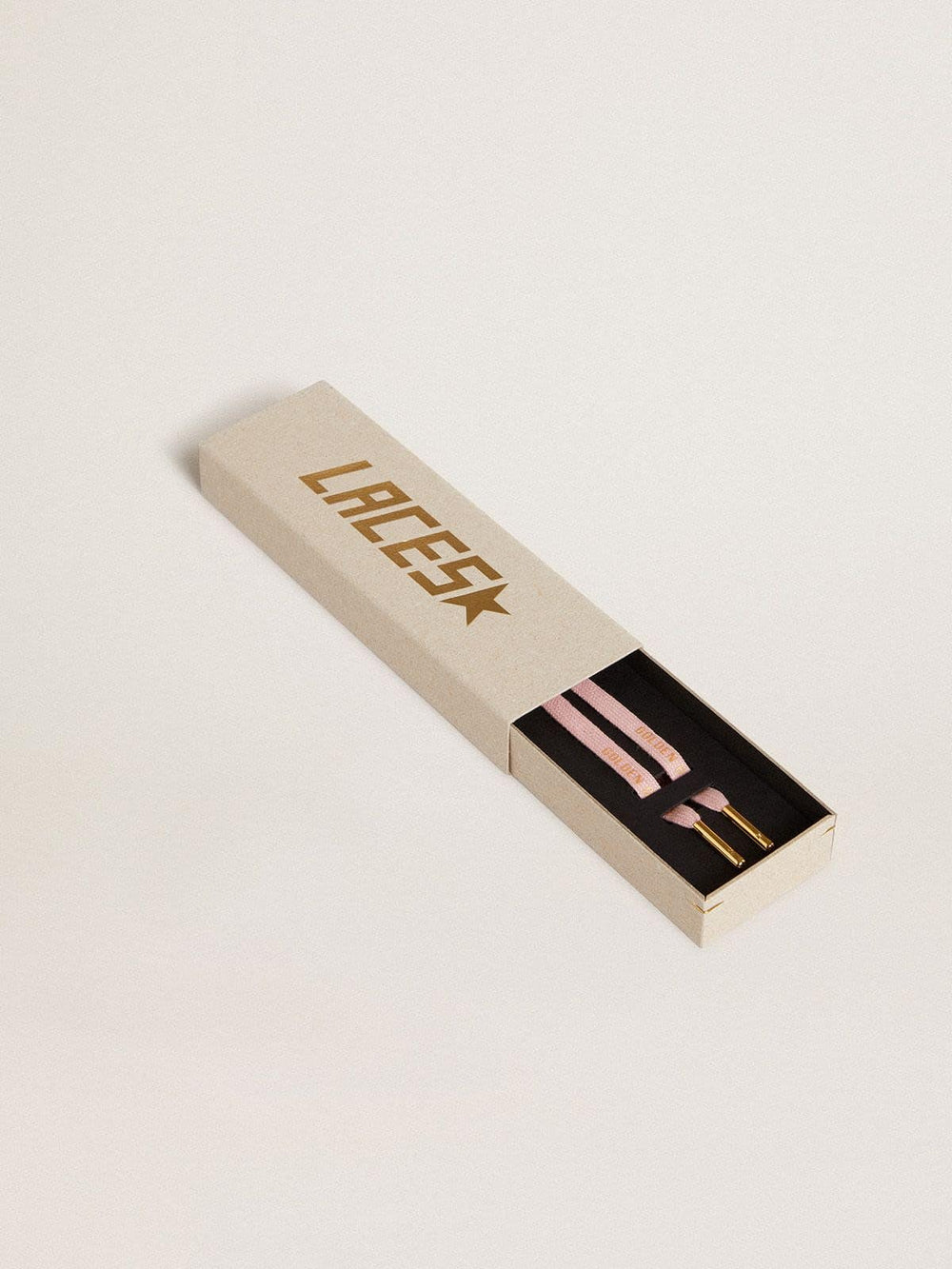 Pink cotton laces with contrasting gold logo