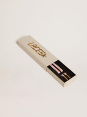 Pink cotton laces with contrasting gold logo