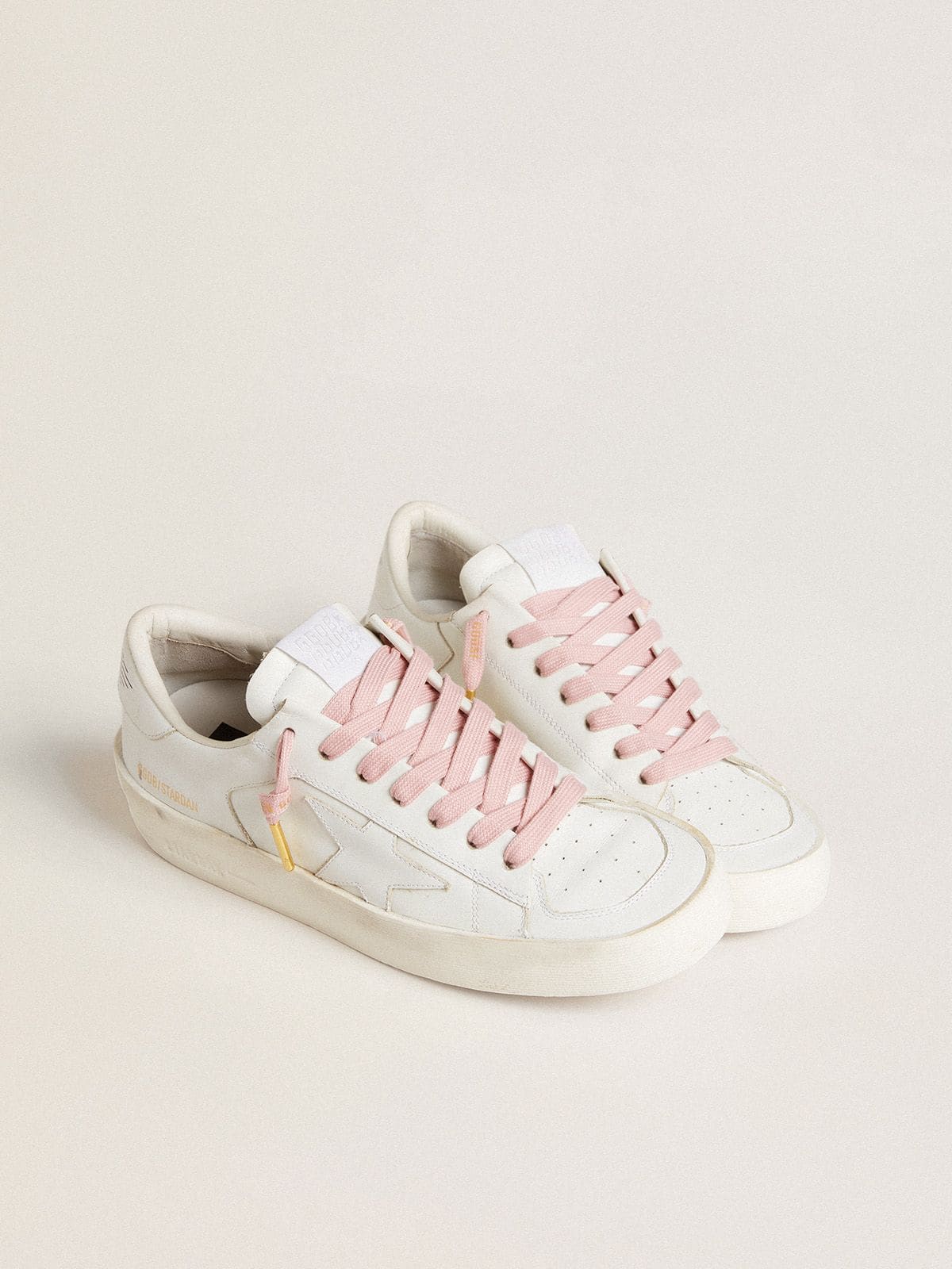 Pink cotton laces with contrasting gold logo
