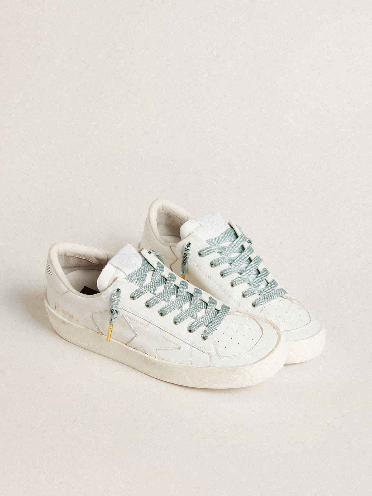 Gray Lurex laces with contrasting black logo