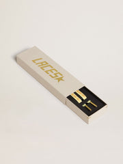 Yellow cotton laces with contrasting gold-colored logo