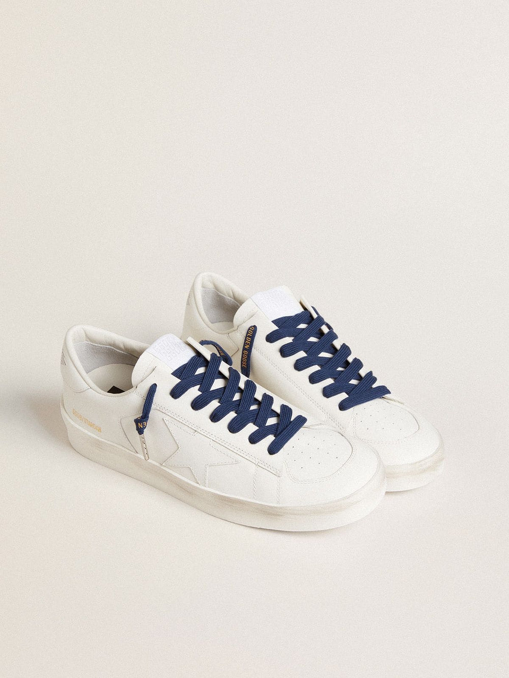 Navy blue cotton laces with contrasting gold logo