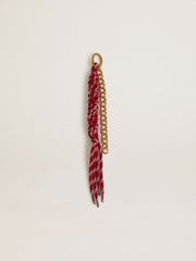 Charm with red knotted laces