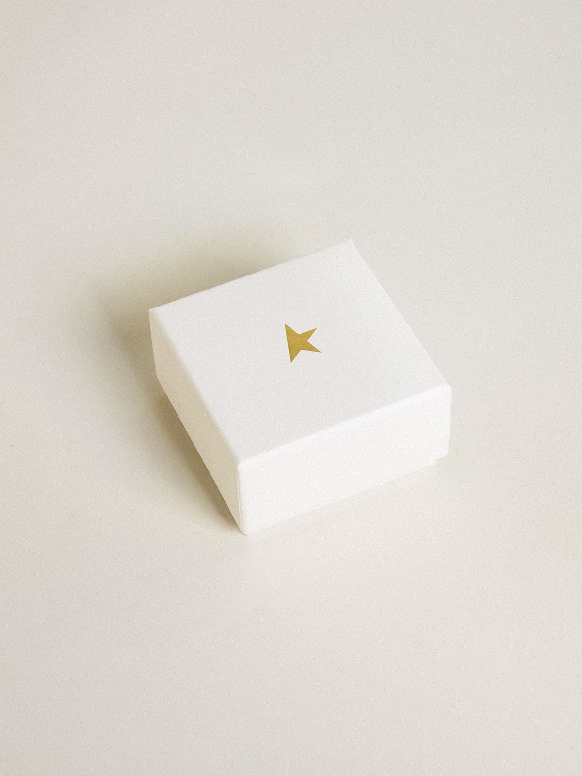 Letter X charm in gold-colored brass with crystals
