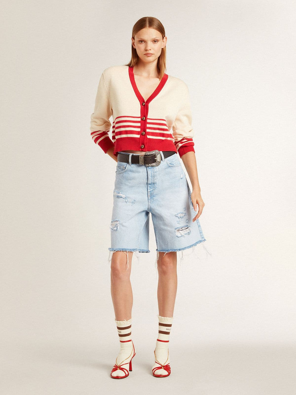 Worn-white socks with distressed details and brown stripes