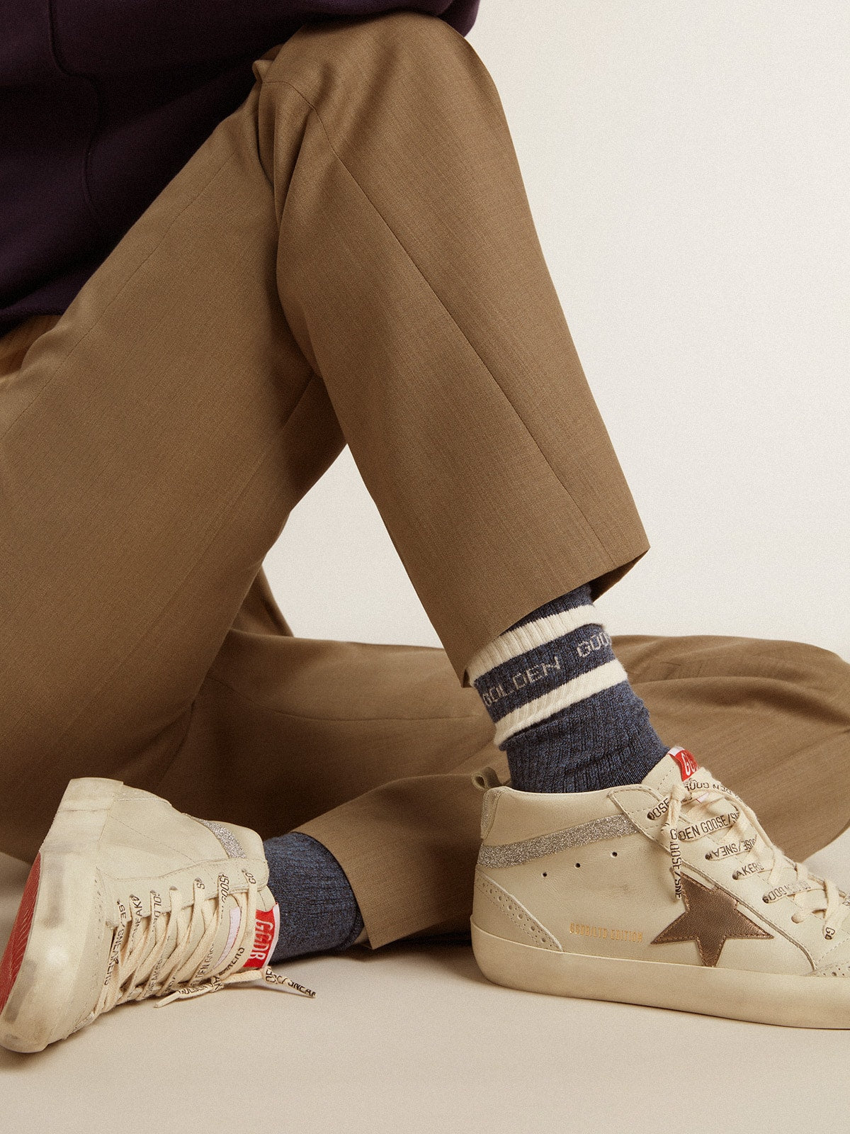 Blue socks with contrasting white stripes and white logo