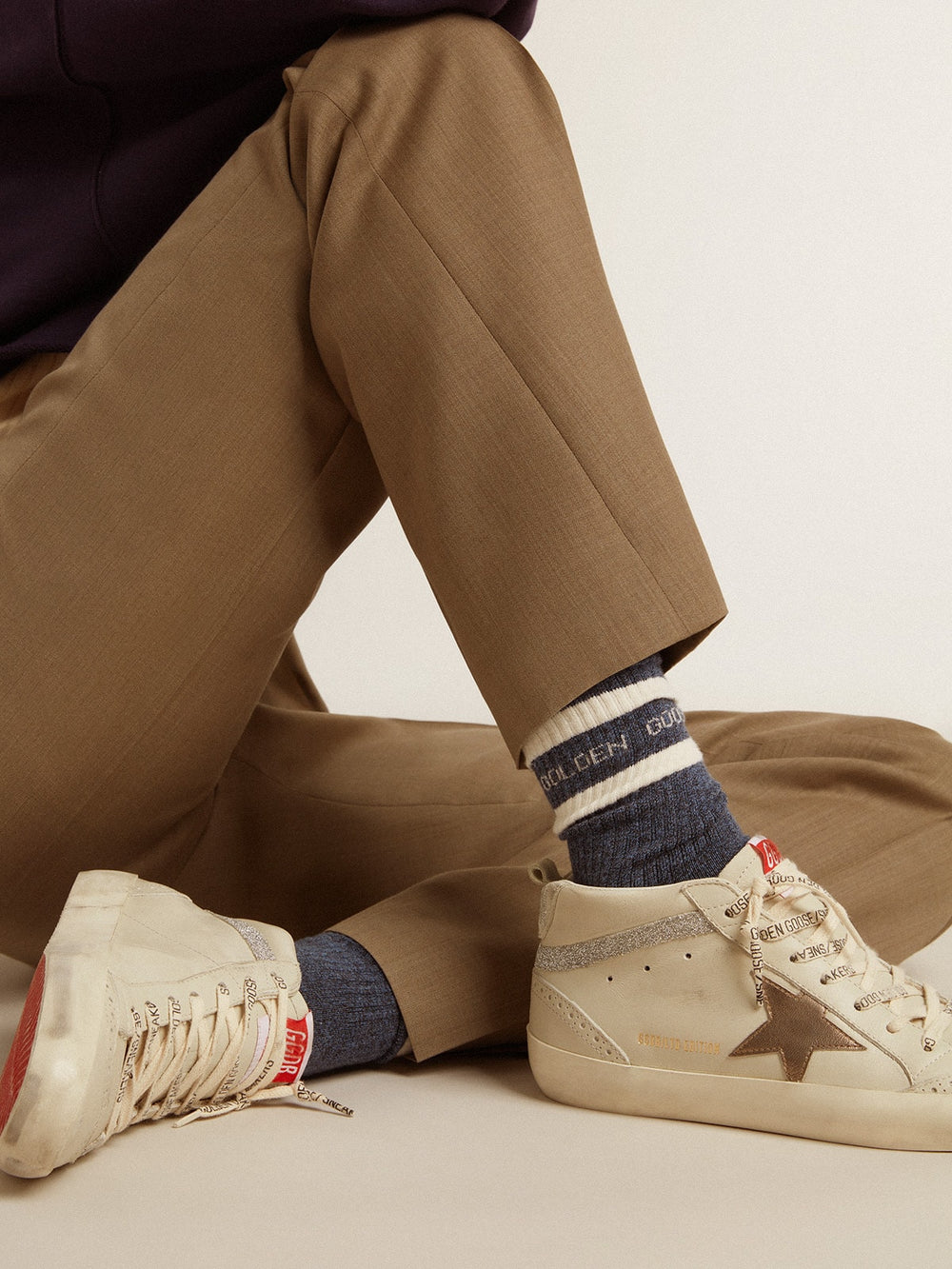 Blue socks with contrasting white stripes and white logo