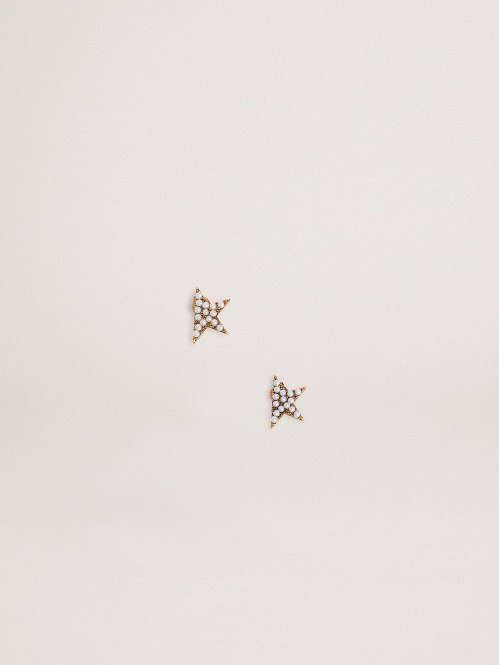 Women's stud earrings in antique gold color with decorative beads