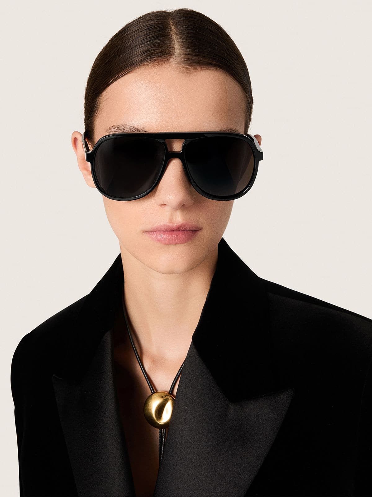 Aviator style sunglasses with black frame and lenses
