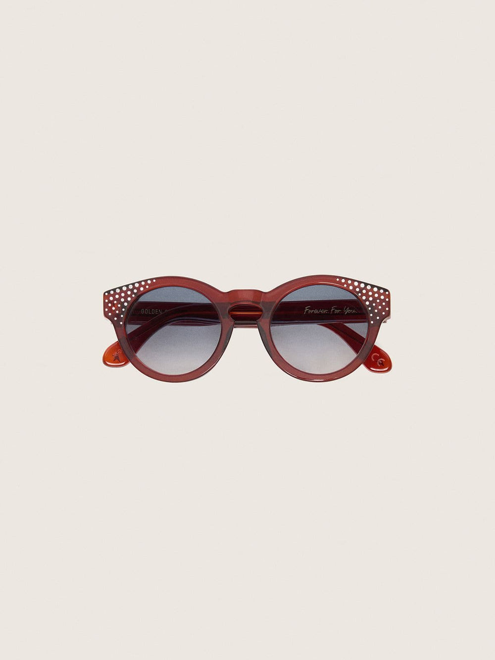 Cameron Panthos sunglasses with honey frame, precious stones and blue lenses
