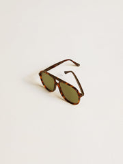 Aviator style sunglasses with tortoiseshell frame and green lenses
