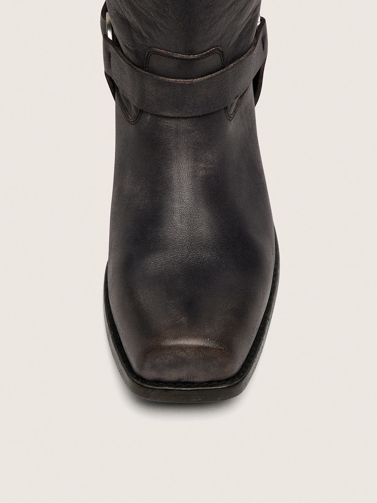 Women's high Biker boots in black leather with strap and silver-colored buckle
