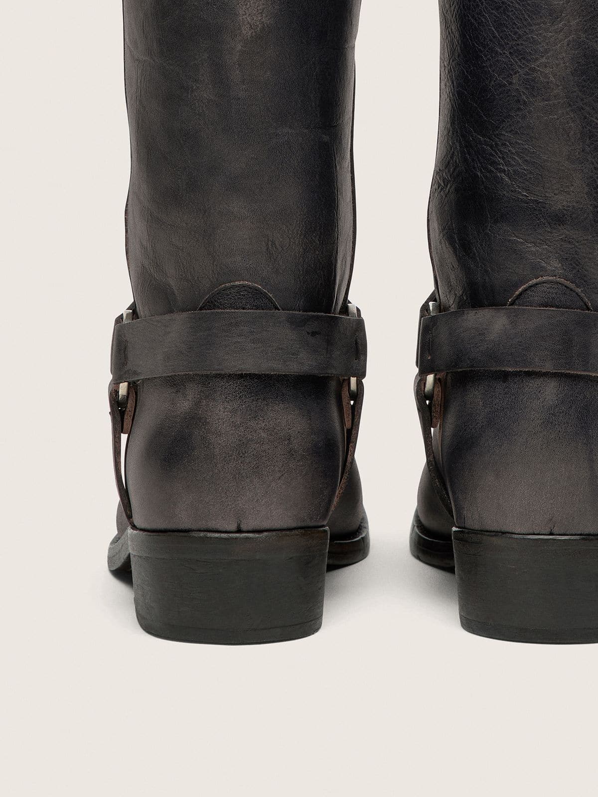 Women's high Biker boots in black leather with strap and silver-colored buckle