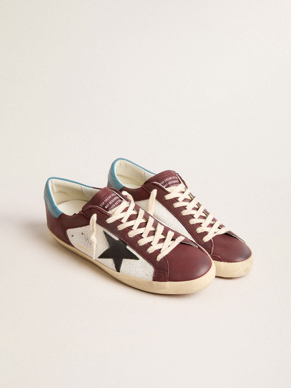 Men’s Super-Star in crackle leather with brown star and teal heel tab