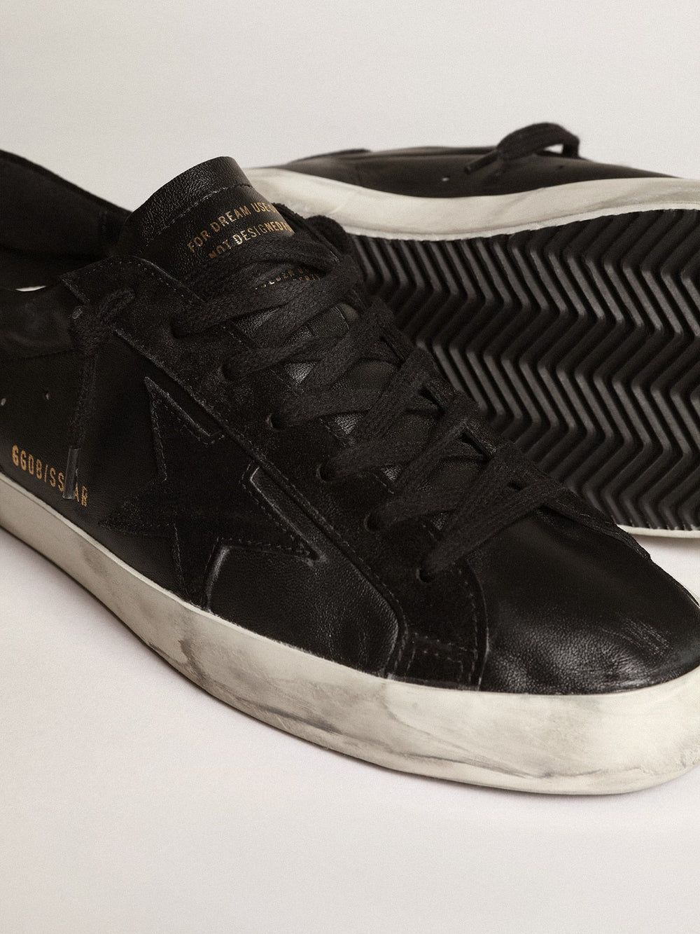 Men's Super-Star in black nappa with black suede star and heel tab