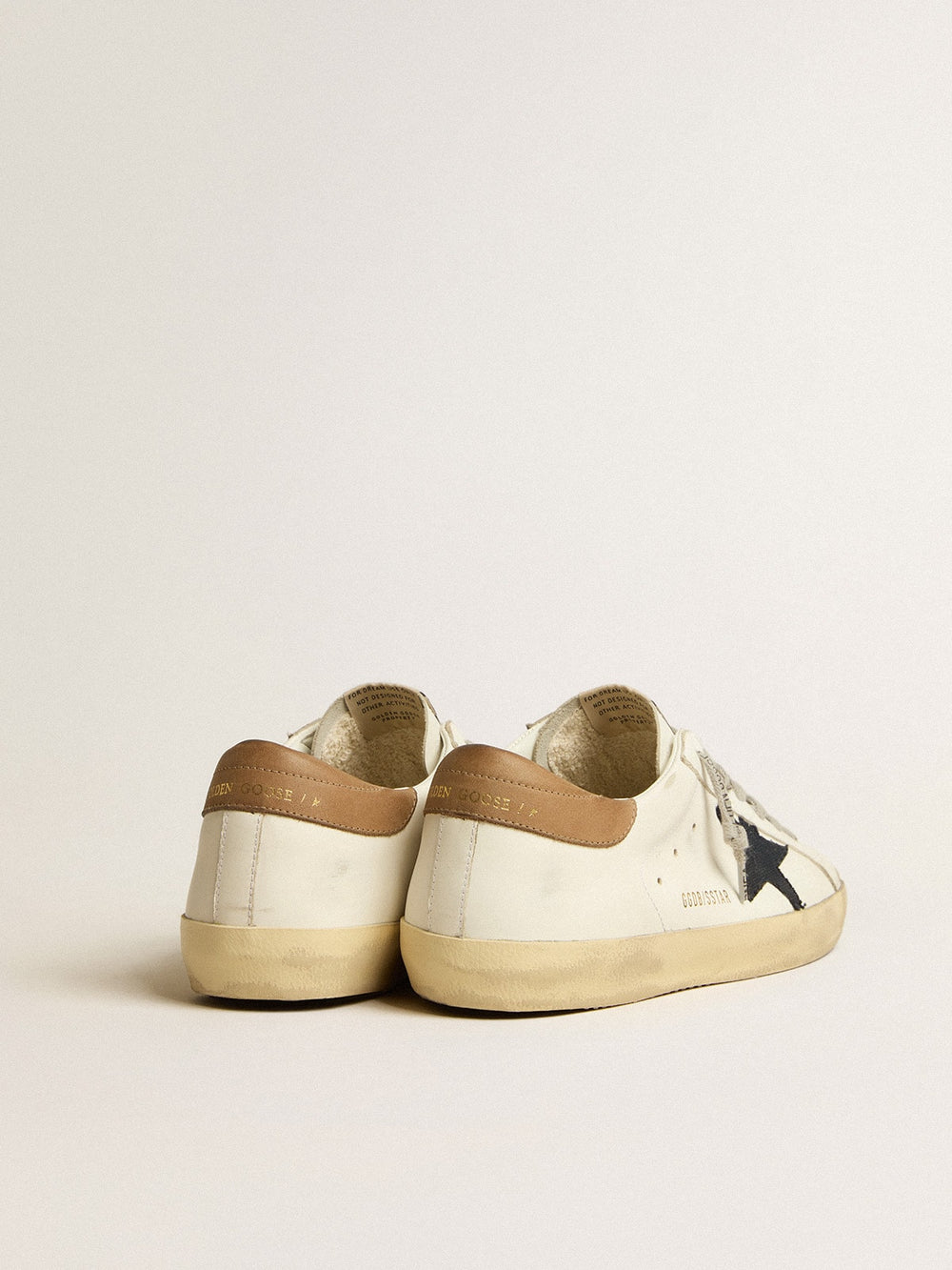 Men's Super-Star in white leather with midnight-blue canvas star and tobacco leather heel tab