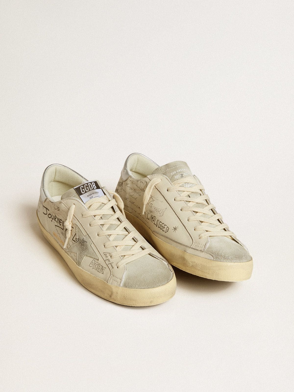 Men's Super-Star  in white leather with all-over lettering and ice-gray suede star