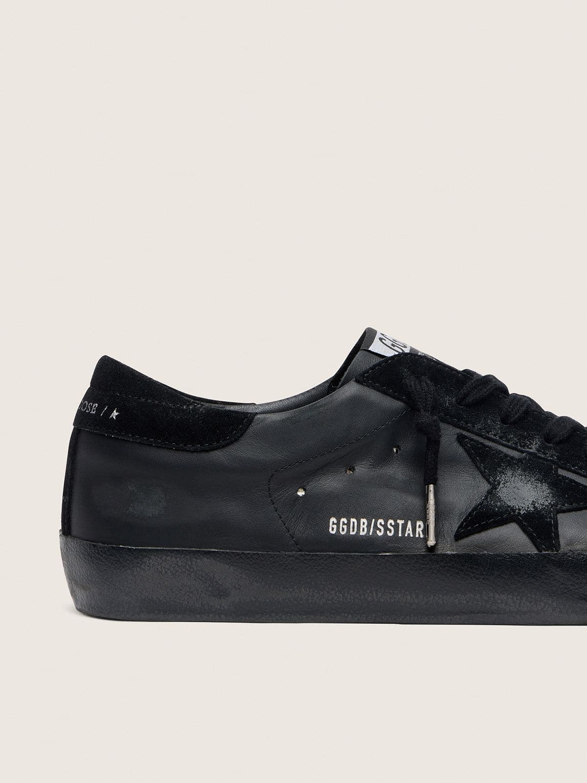 Men's Super-Star in black nappa with black suede star and heel tab