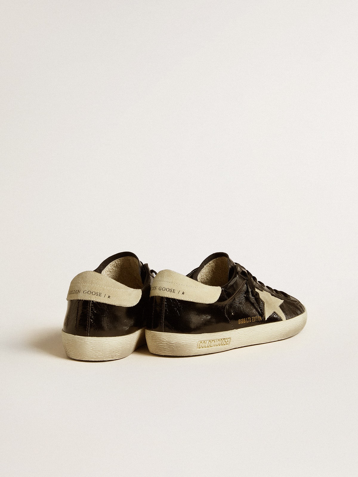 Men's Super-Star  in black patent leather with suede star and heel tab