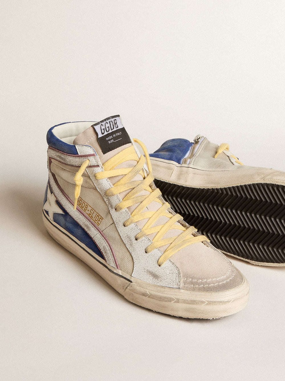 Slide in pearl canvas and blue suede with white leather star and flash