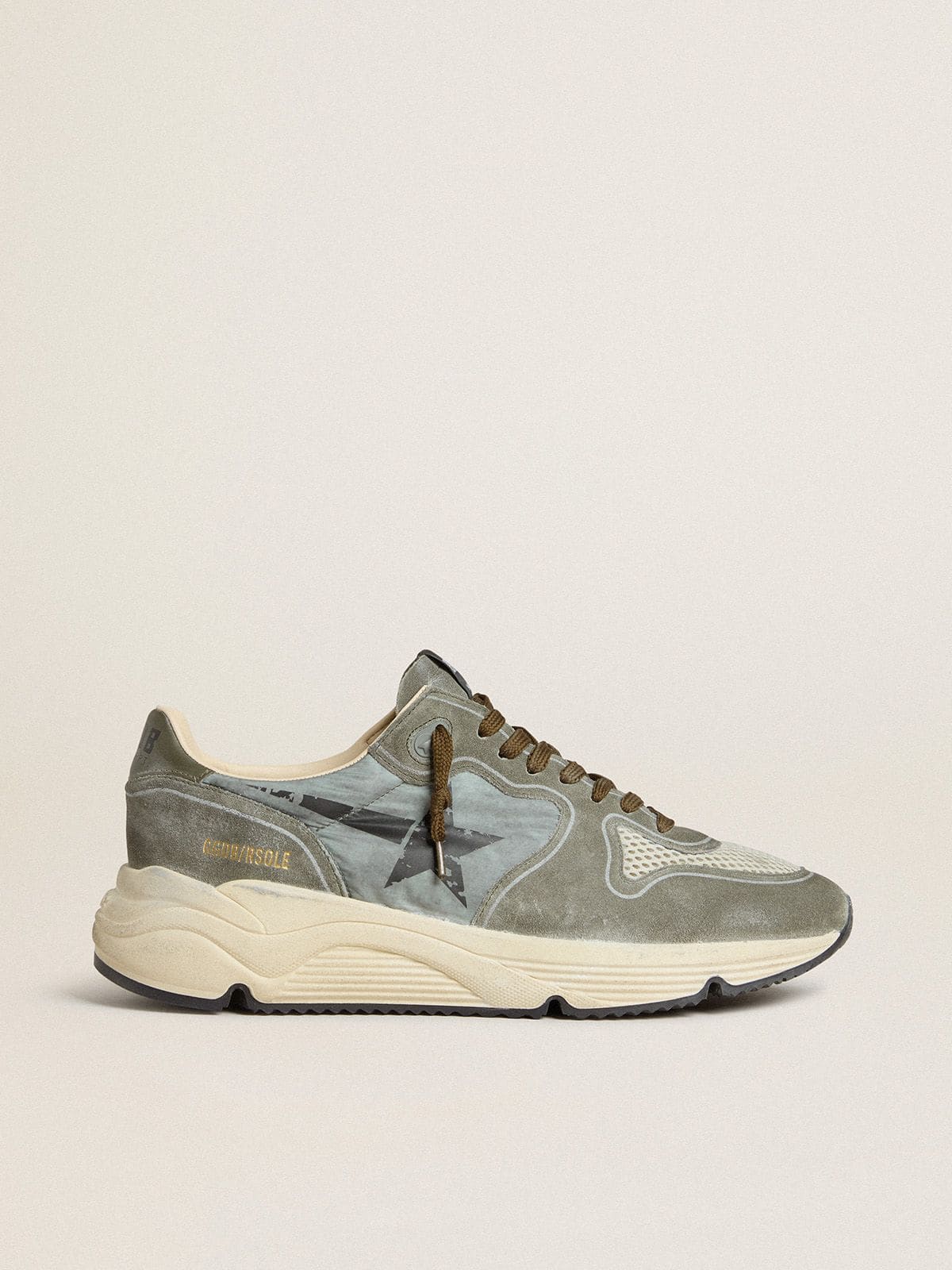 Men's Running Sole in light blue nylon with black star and green leather heel tab