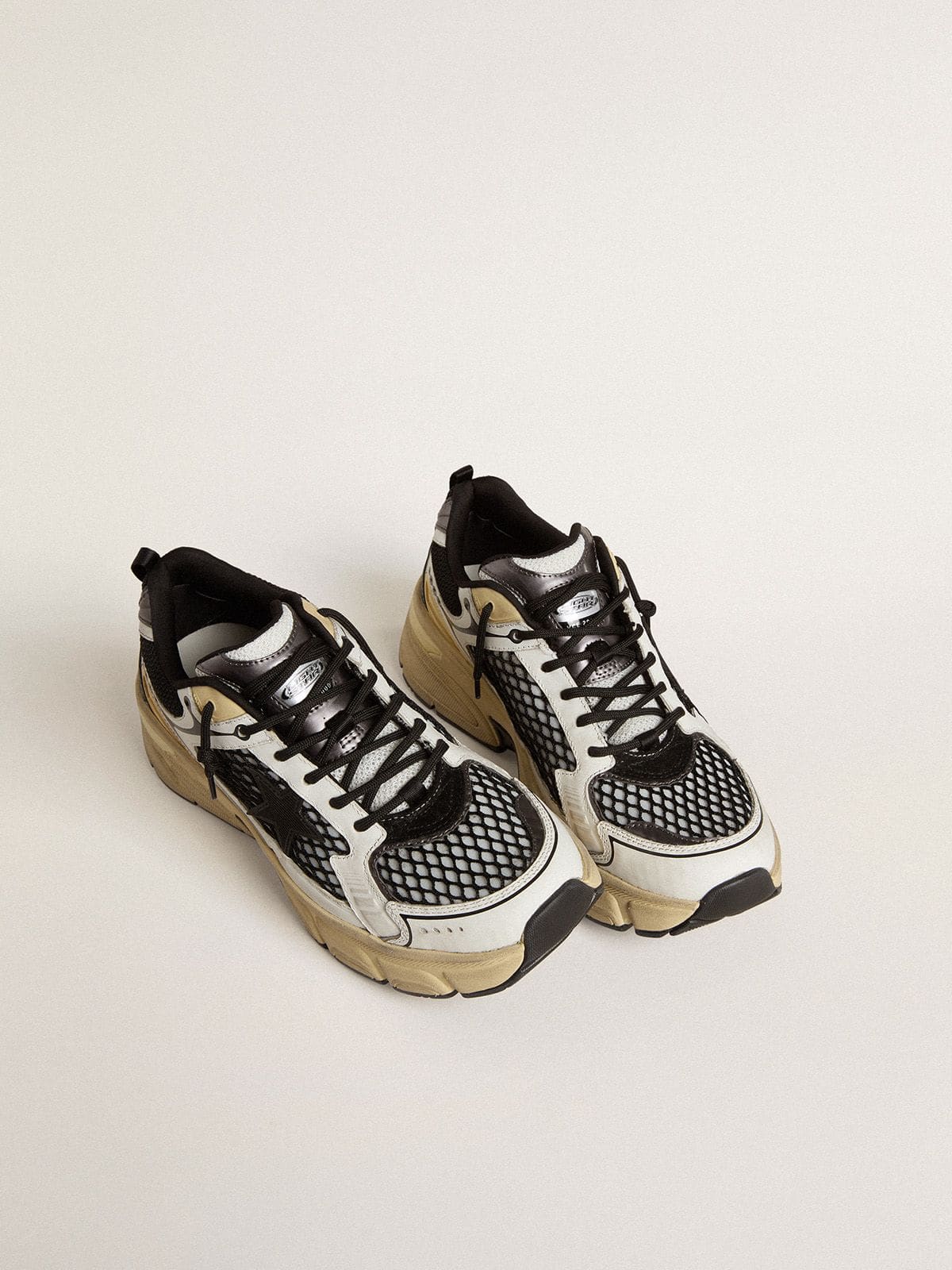 Men’s Lightstar in white leather and black mesh with black TPU star