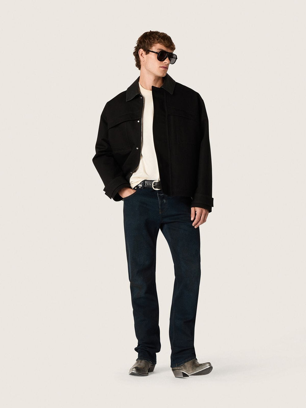 Men's short padded jacket in black cotton with leather collar