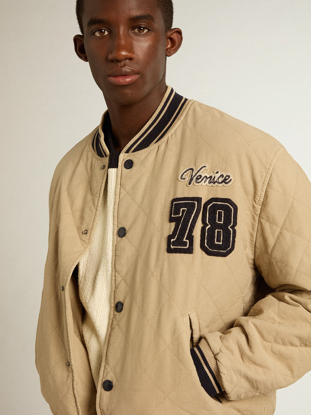 Khaki-colored quilted cotton bomber jacket