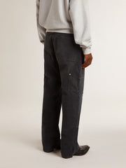 Men's distressed black cotton jeans with front patches