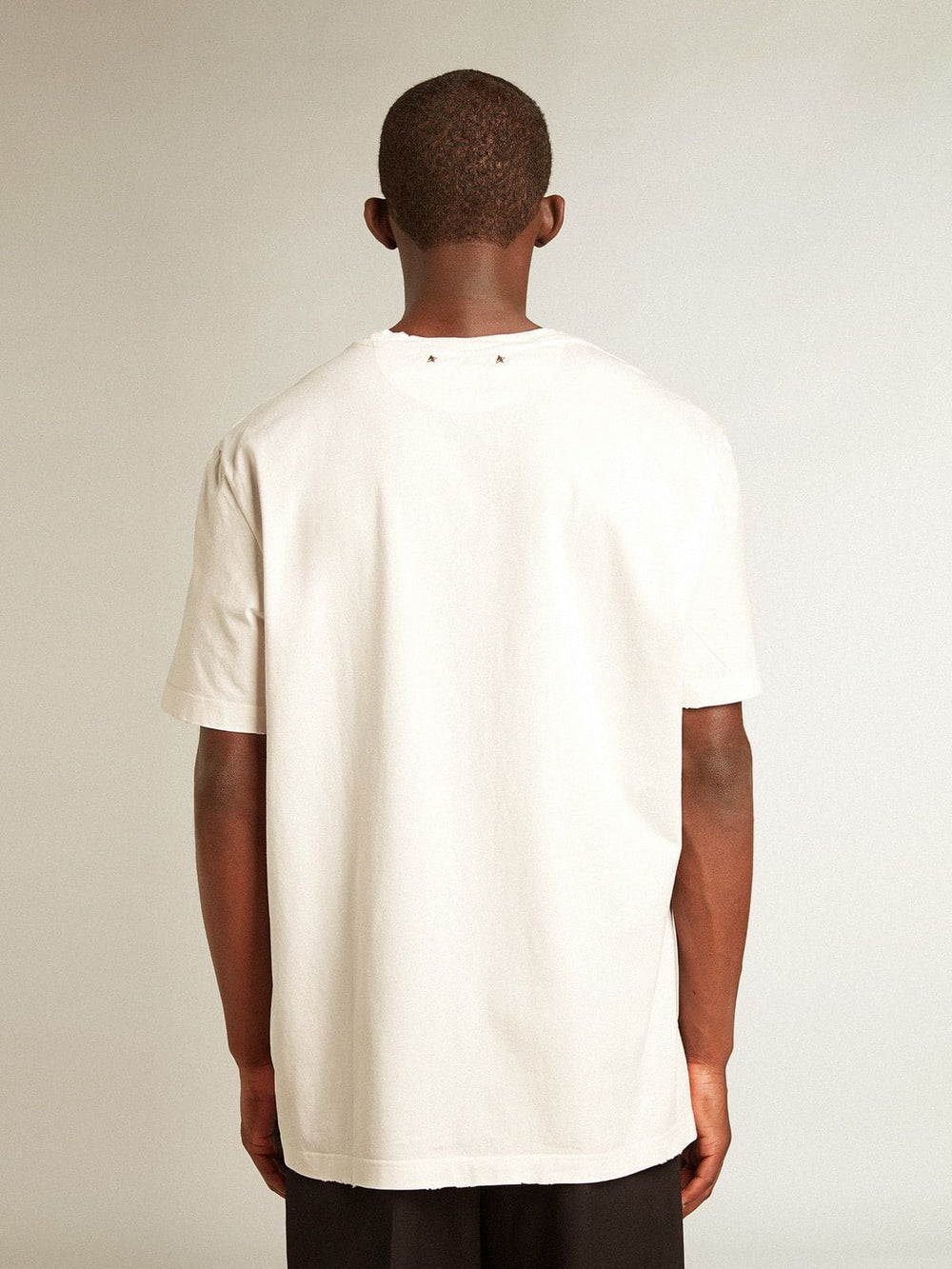 Men's white T-shirt with distressed treatment