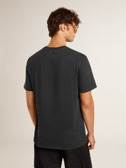 Men’s worn-black cotton T-shirt with print on the front