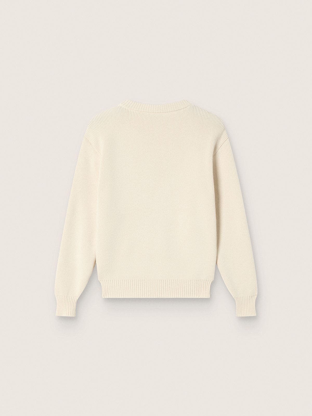 Golden girls’ sweater in white cotton yarn with mascot embroidery