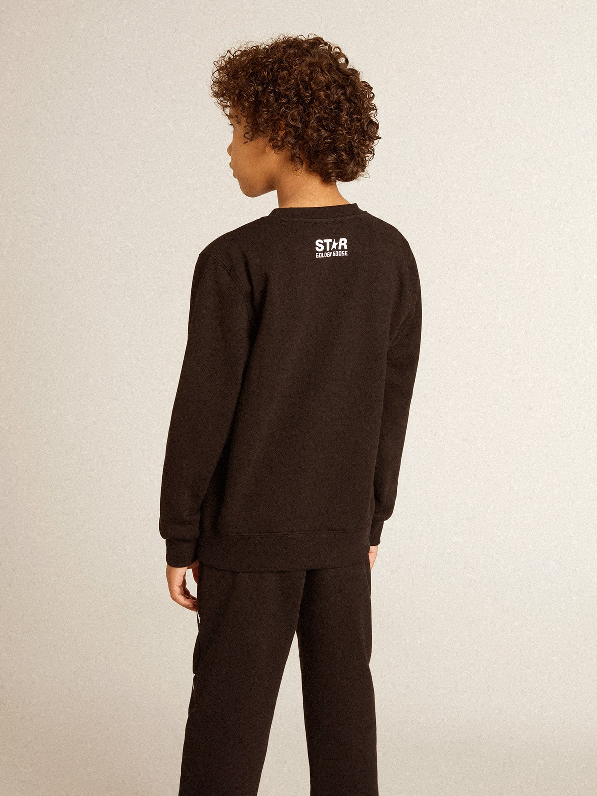 Boys’ black sweatshirt with white maxi star on the front