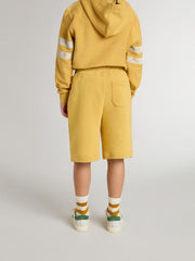 Kids jogging shorts in ochre yellow with embroidery