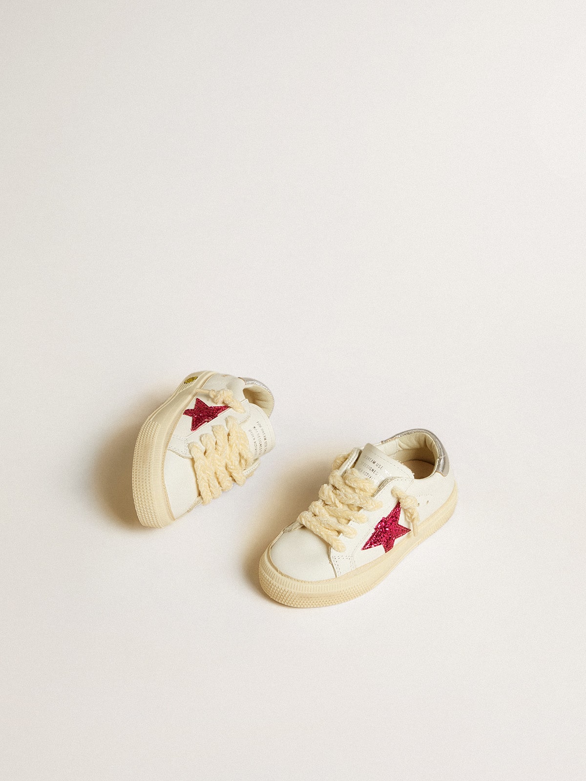 May Junior with fuchsia glitter star and metallic leather heel tab