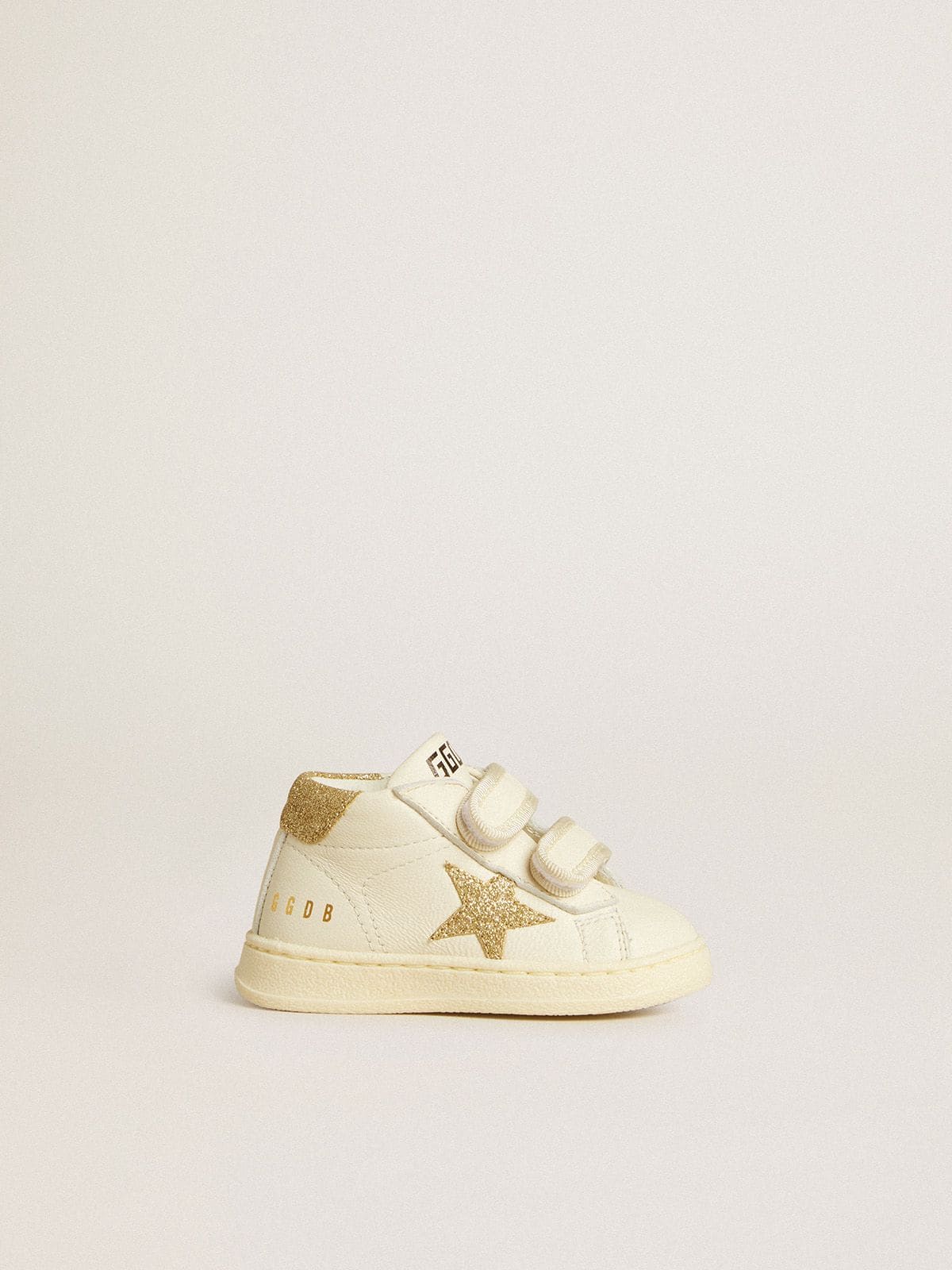 June Junior in white nappa leather with gold glitter star and heel tab
