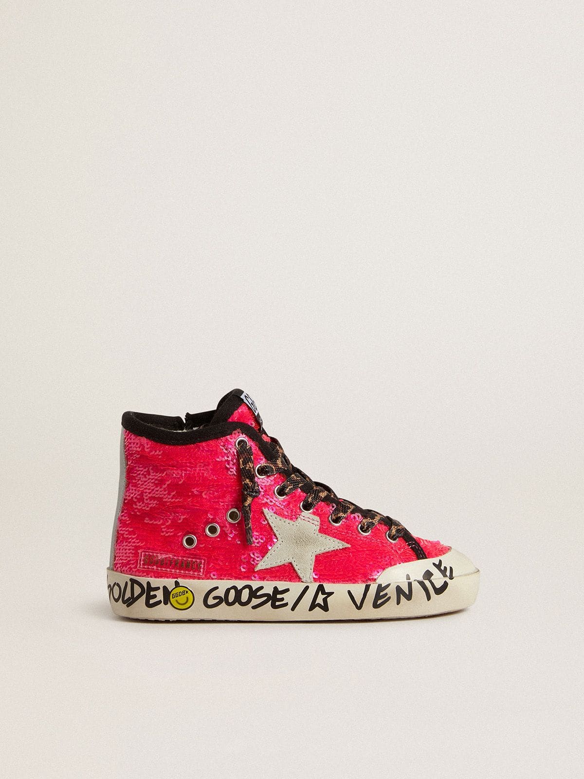 Young Francy in sequins with ice-gray suede star and animal-print laces