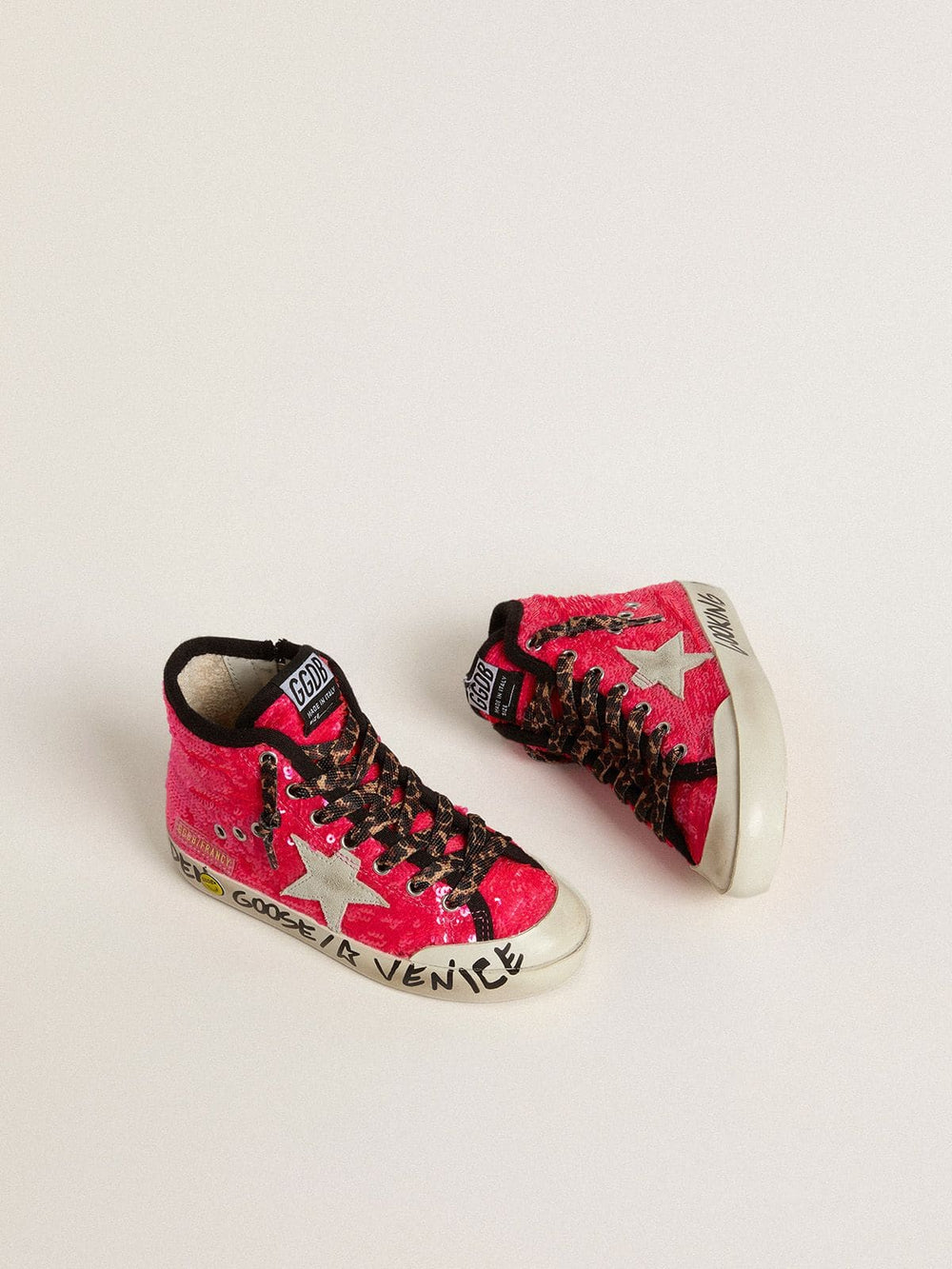 Young Francy in sequins with ice-gray suede star and animal-print laces