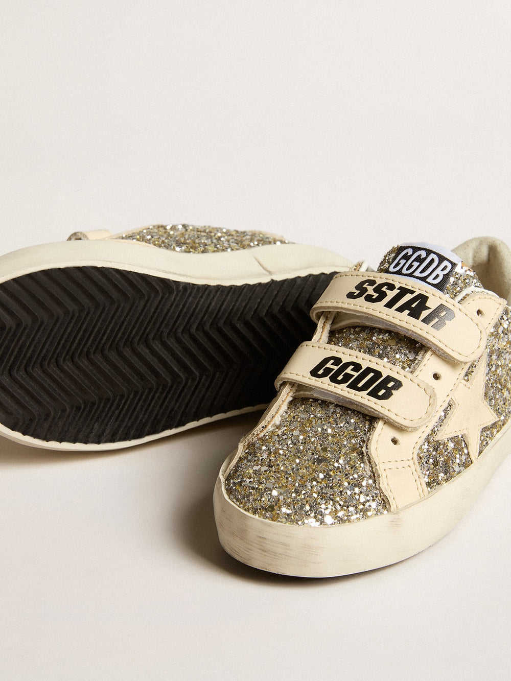 Old School Young in platinum glitter with leather star and heel tab