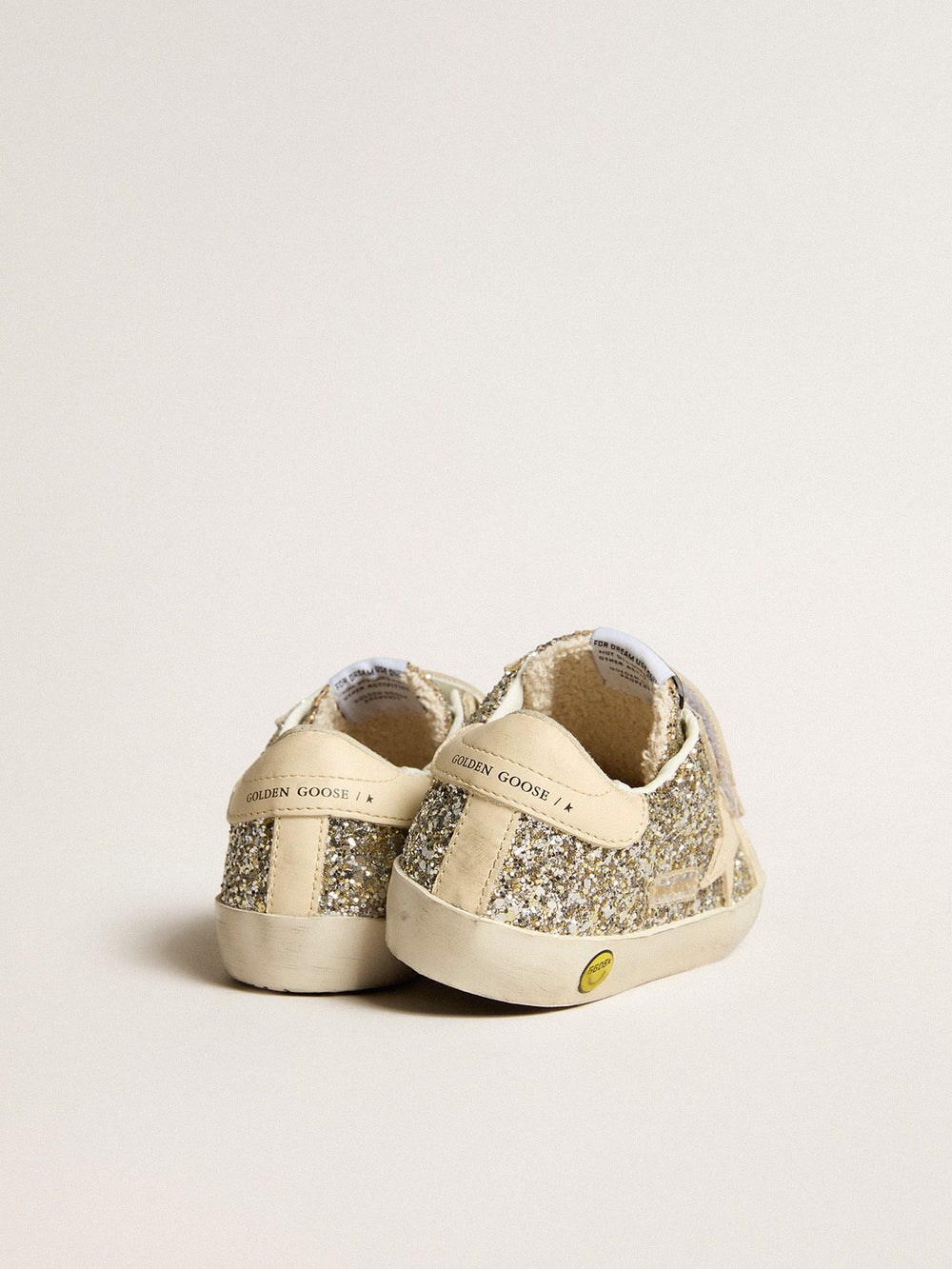 Old School Young in platinum glitter with leather star and heel tab