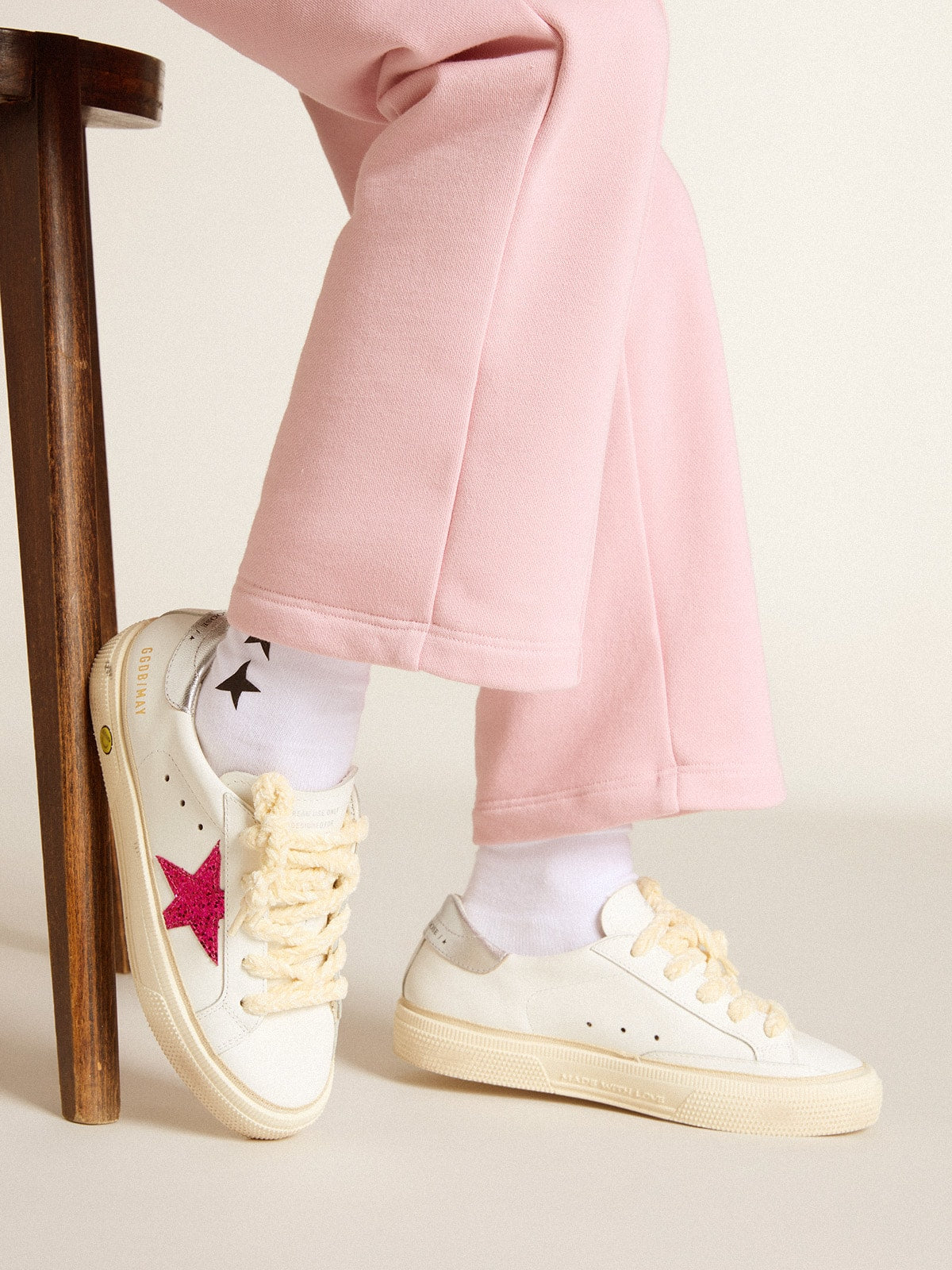 May Young with fuchsia glitter star and metallic leather heel tab
