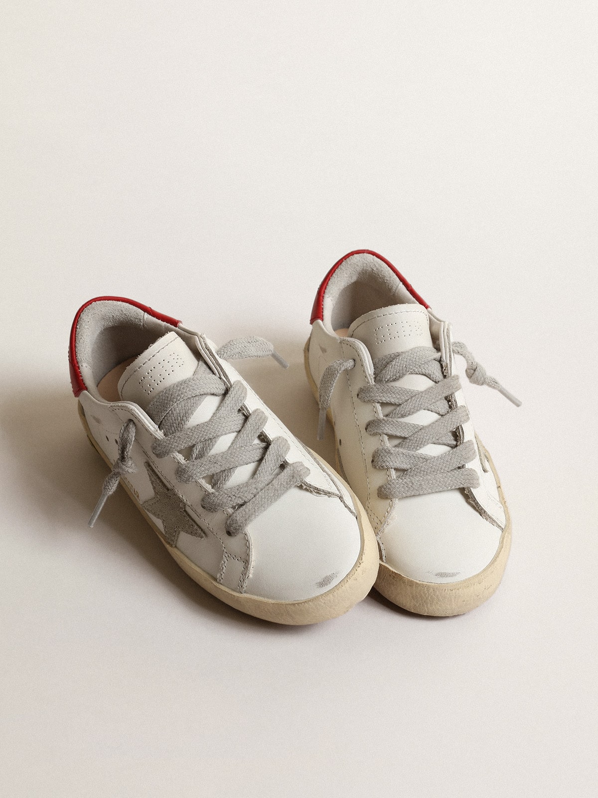 Super-Star Young with suede star and red leather heel tab