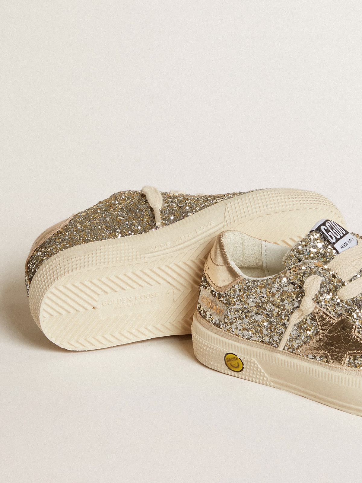 May Young in platinum glitter with metallic leather star and heel tab