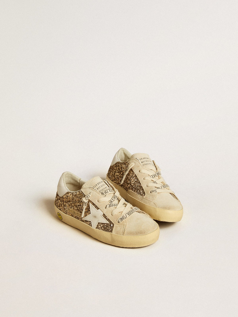 Super-Star Young in gold glitter with white leather star and heel tab