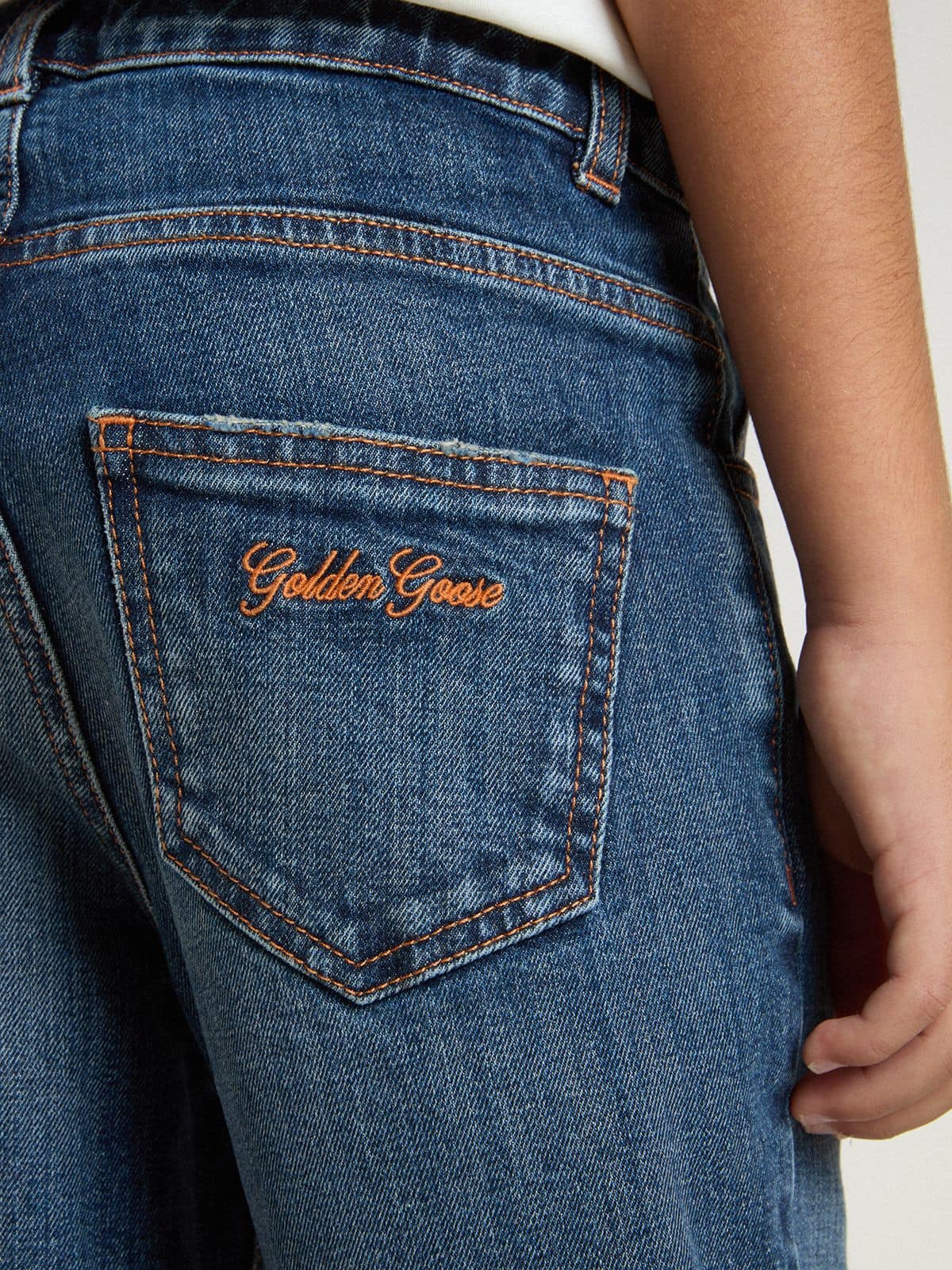 Boys' denim jeans with a raw edge and embroidery