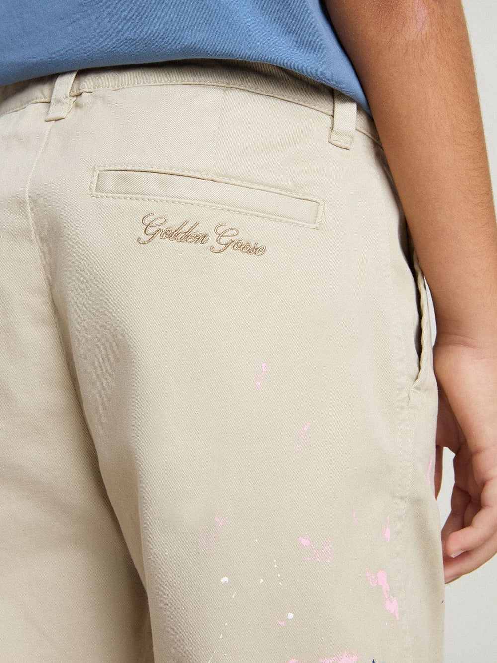 Kids’ beige chino pants with multicolor splashes