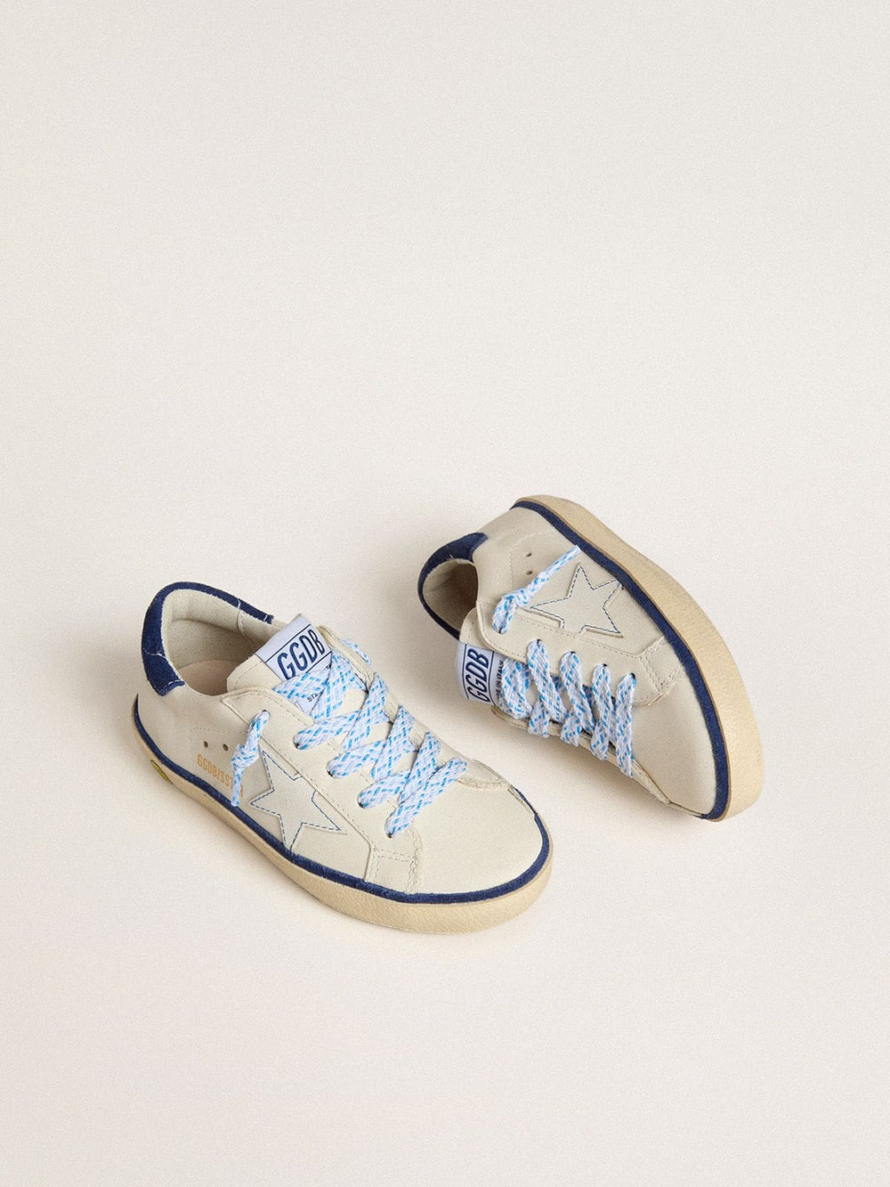 Young Super-Star in white leather with blue suede heel tab