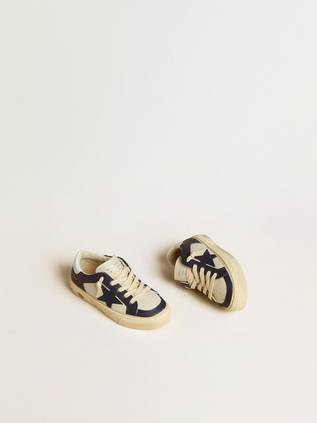 May Young in white and blue leather with leather star and heel tab
