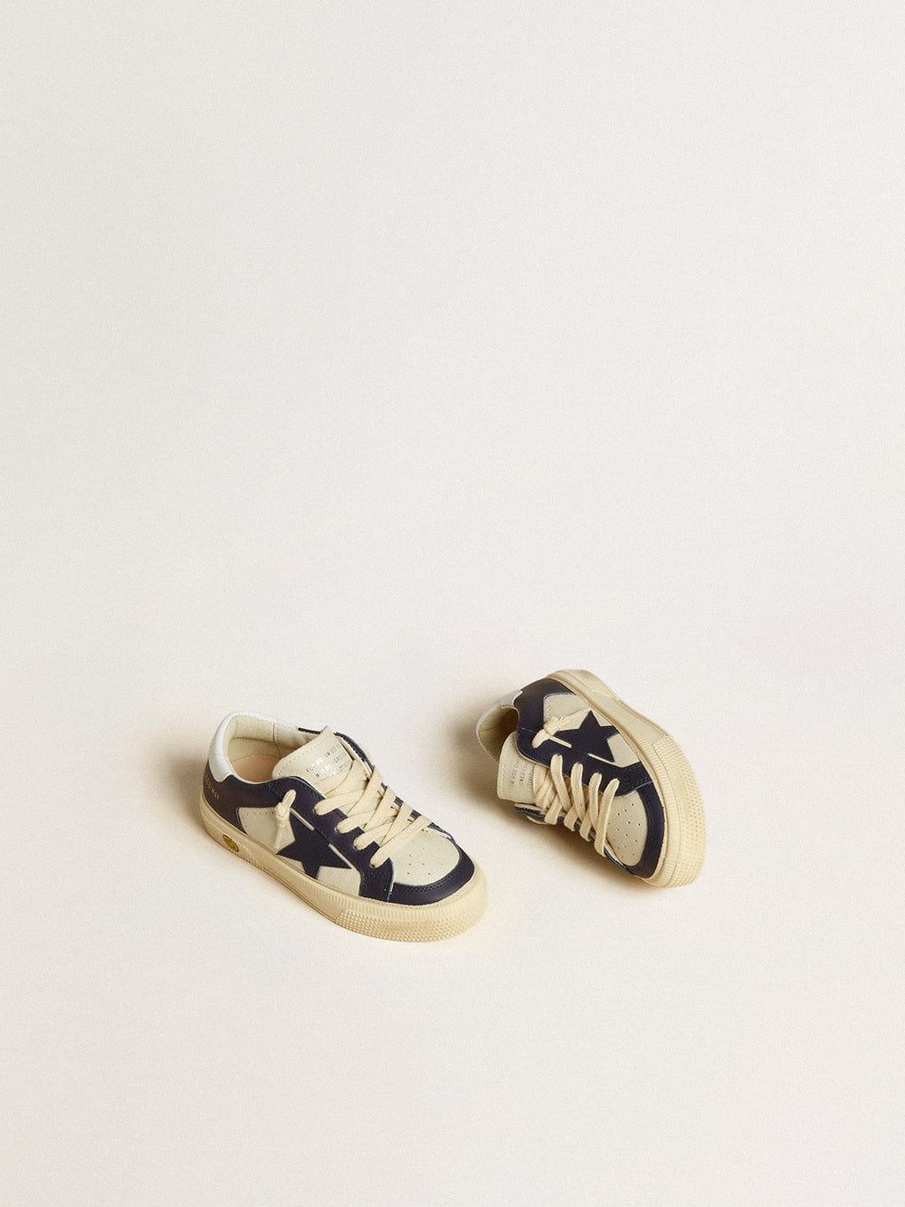 May Young in white and blue leather with leather star and heel tab
