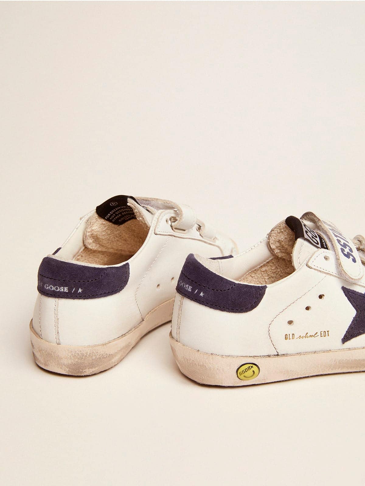 Old School Young in white leather with blue suede star and heel tab